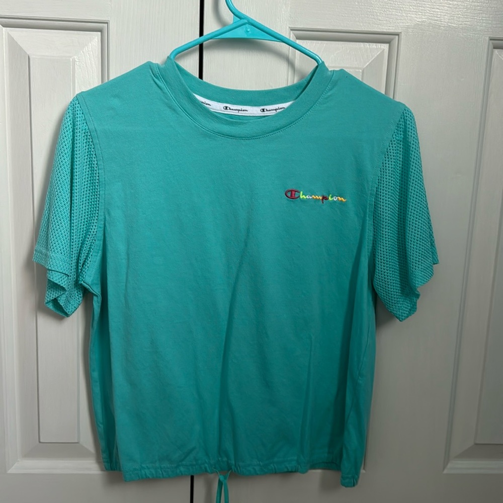 Teal Champion cropped shirt.
